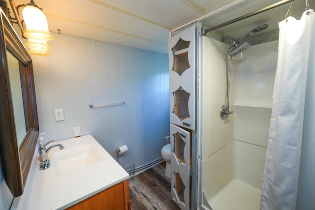 N7120 Sullivan Ln, New Lisbon, WI 53950 - bathroom featuring a stall shower, toilet, wood finished floors, and vanity