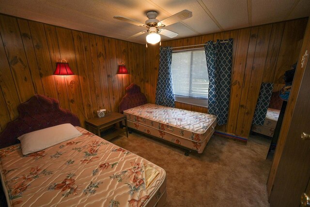 N7120 Sullivan Ln, New Lisbon, WI 53950 - bedroom with wood walls, carpet, and a ceiling fan