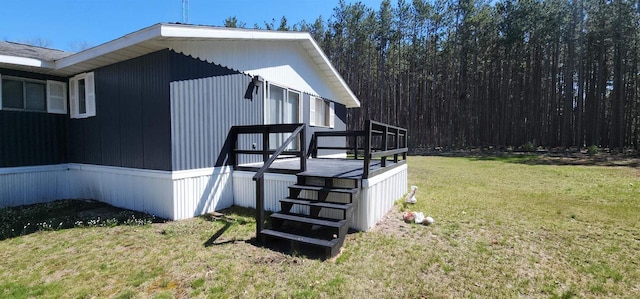 N7120 Sullivan Ln, New Lisbon, WI 53950 - view of property exterior with a yard and a deck