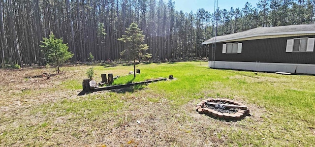 N7120 Sullivan Ln, New Lisbon, WI 53950 - view of green lawn with an outdoor fire pit