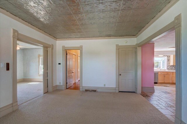 3756 E County Rd N, Milton, WI 53563 - carpeted empty room with an ornate ceiling, ornamental molding, and baseboards