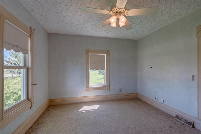 3756 E County Rd N, Milton, WI 53563 - carpeted spare room with plenty of natural light, a textured ceiling, baseboards, and ceiling fan