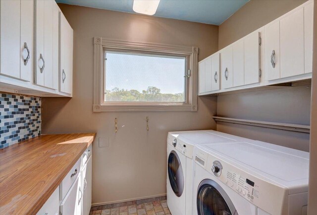 3756 E County Rd N, Milton, WI 53563 - washroom featuring washing machine and dryer, cabinet space, and baseboards