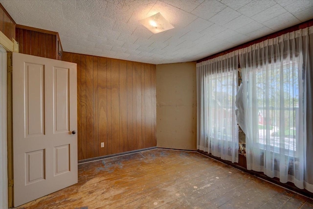 3756 E County Rd N, Milton, WI 53563 - empty room with wood walls and wood-type flooring