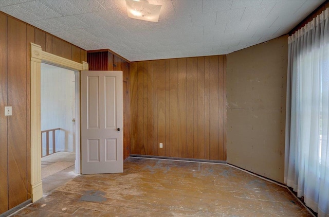 3756 E County Rd N, Milton, WI 53563 - unfurnished room with wood walls and wood-type flooring