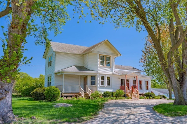 3756 E County Rd N, Milton, WI 53563 - view of front of home featuring covered porch and a front lawn