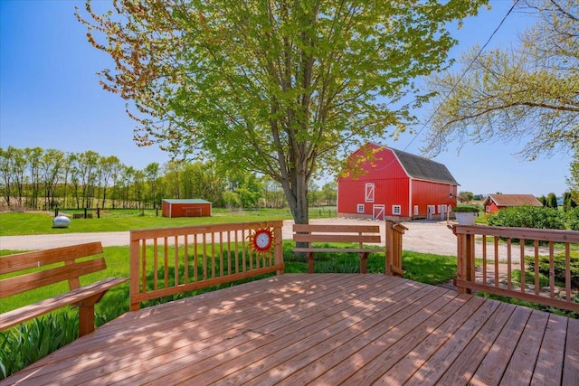3756 E County Rd N, Milton, WI 53563 - wooden terrace featuring a barn, an outdoor structure, a yard, and a shed