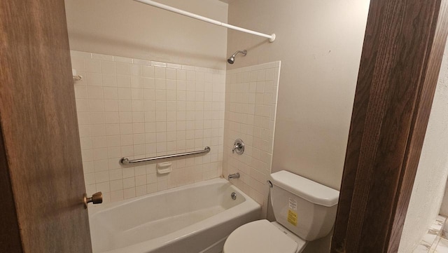 bathroom featuring toilet and bathtub / shower combination