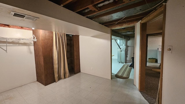 below grade area with tile patterned floors and visible vents