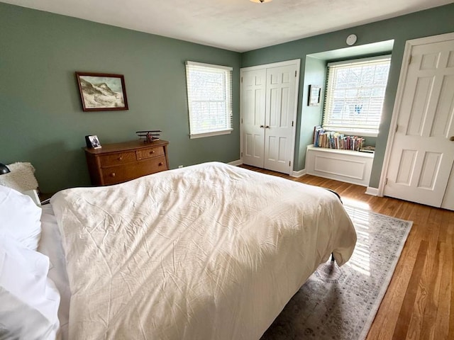 1651 E Ridge Rd, Beloit, WI 53511 - bedroom featuring wood finished floors, baseboards, and a closet