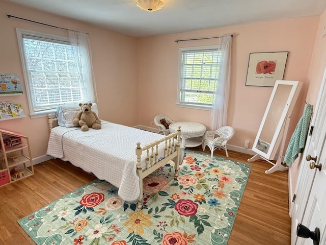 1651 E Ridge Rd, Beloit, WI 53511 - bedroom featuring wood finished floors and baseboards
