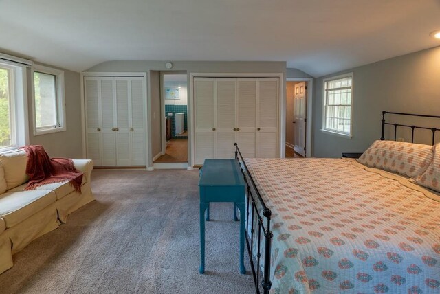 1651 E Ridge Rd, Beloit, WI 53511 - carpeted bedroom featuring lofted ceiling, multiple closets, and baseboards