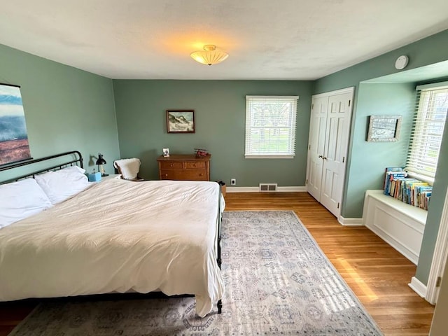 1651 E Ridge Rd, Beloit, WI 53511 - bedroom featuring wood finished floors and baseboards