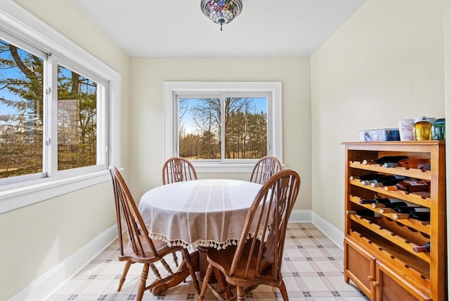 6309 12th St, Kenosha, WI 53144 - dining space featuring light floors, baseboards, and a healthy amount of sunlight