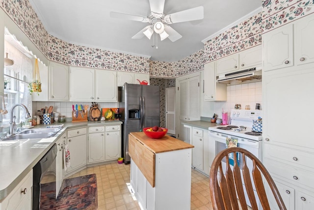 kitchen with light floors, dishwasher, under cabinet range hood, and stainless steel refrigerator with ice dispenser