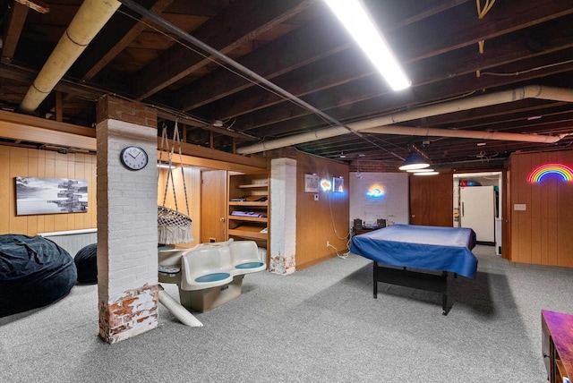 playroom featuring wood walls and carpet floors