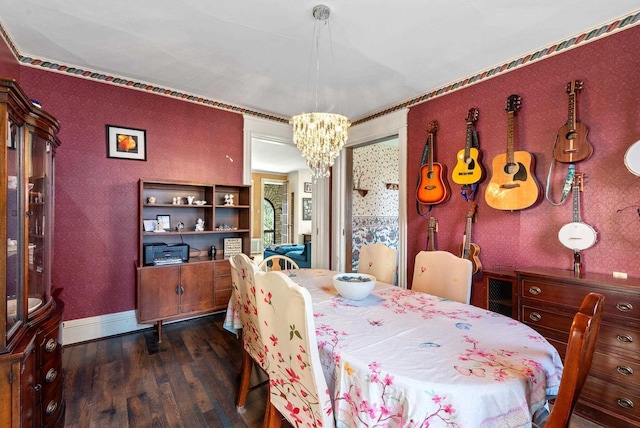 dining room featuring baseboards, dark wood-style flooring, an inviting chandelier, and wallpapered walls