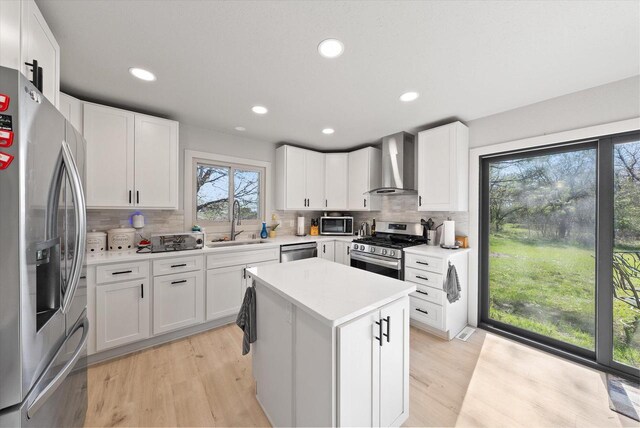1111 Wauwatosa Rd, Cedarburg, WI 53012 - kitchen with backsplash, wall chimney range hood, stainless steel appliances, and a sink