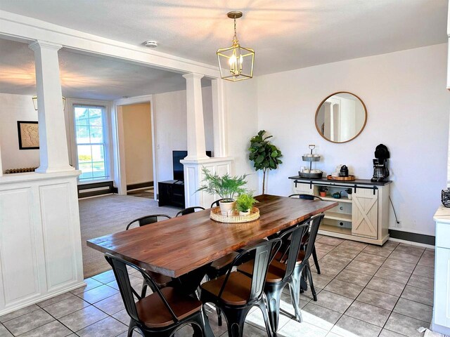 201 S Beaumont Rd, Prairie Du Chien, WI 53821 - dining space featuring light tile patterned flooring and decorative columns