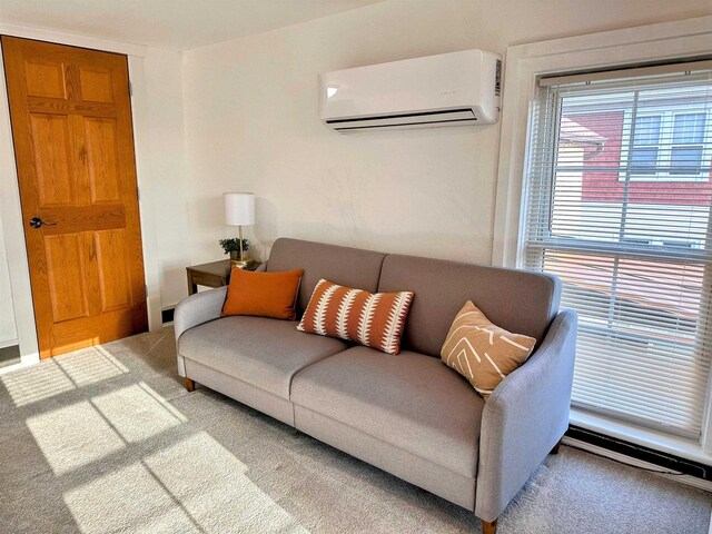 201 S Beaumont Rd, Prairie Du Chien, WI 53821 - carpeted living room with an AC wall unit