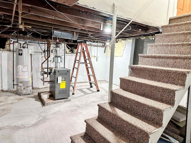 201 S Beaumont Rd, Prairie Du Chien, WI 53821 - basement with water heater, stairs, and a heating unit