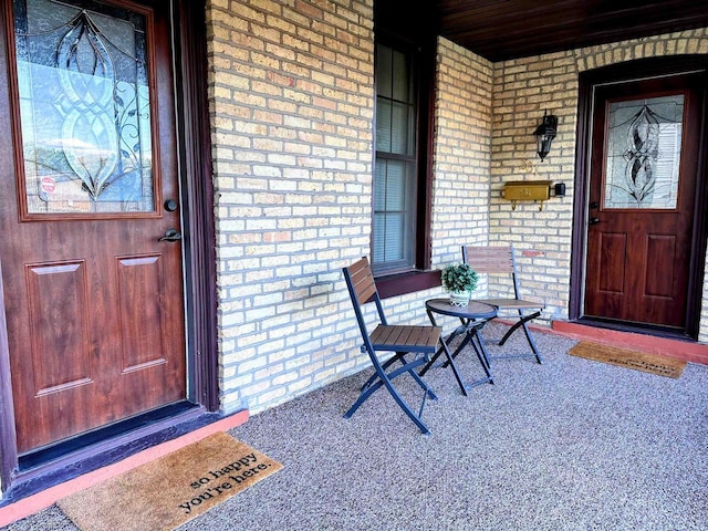 201 S Beaumont Rd, Prairie Du Chien, WI 53821 - view of exterior entry with a porch and brick siding