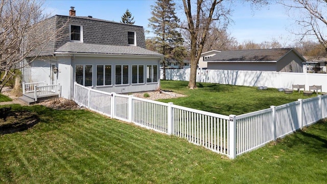view of yard featuring a fenced backyard