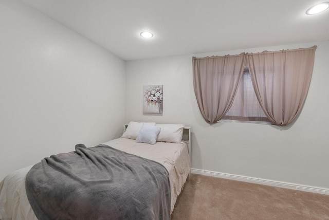 bedroom with carpet floors, baseboards, and recessed lighting