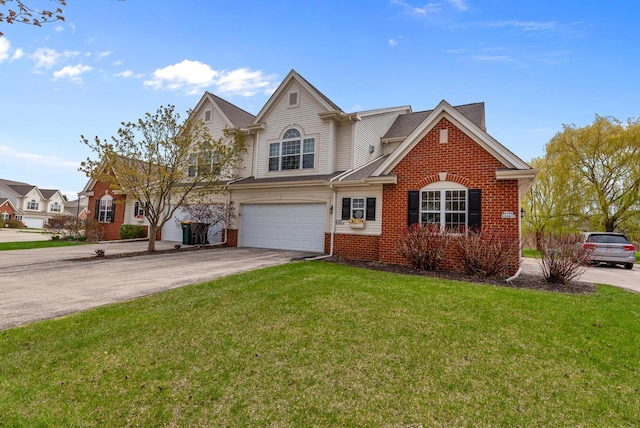 traditional home with an attached garage, concrete driveway, brick siding, and a front yard