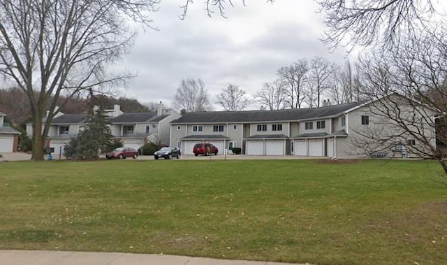37 Ponwood Cir, Madison, WI 53717 - view of front of house with a front yard, an attached garage, and a residential view