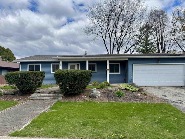 1511 Middleton St, Middleton, WI 53562 - ranch-style house featuring a garage, driveway, and a front yard