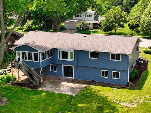 1511 Middleton St, Middleton, WI 53562 - back of house featuring a patio, a lawn, and a shingled roof