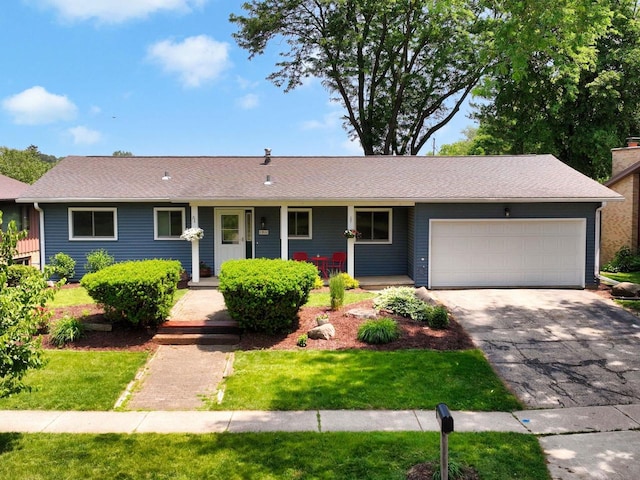 1511 Middleton St, Middleton, WI 53562 - ranch-style home with an attached garage, covered porch, asphalt driveway, and a front lawn