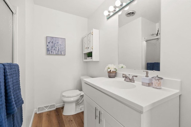 1511 Middleton St, Middleton, WI 53562 - bathroom with wood finished floors, a shower with door, and vanity