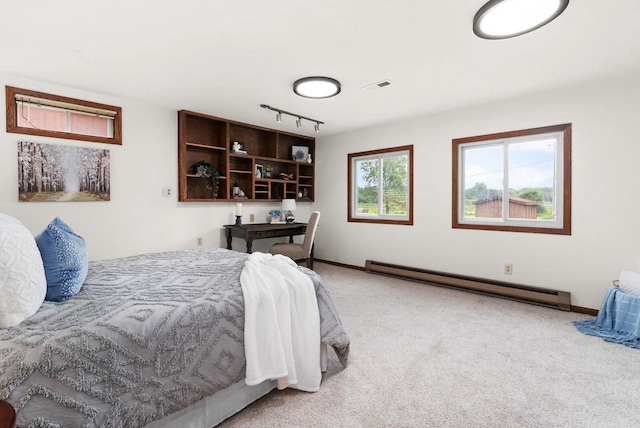1511 Middleton St, Middleton, WI 53562 - carpeted bedroom with baseboard heating and track lighting