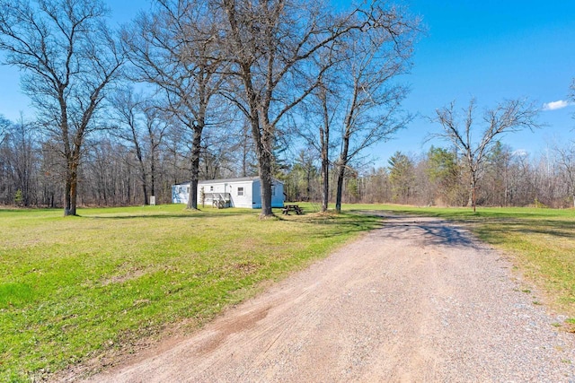 W7730 County Road Z, Pembine, WI 54156 - view of dirt / gravel road featuring a forest view