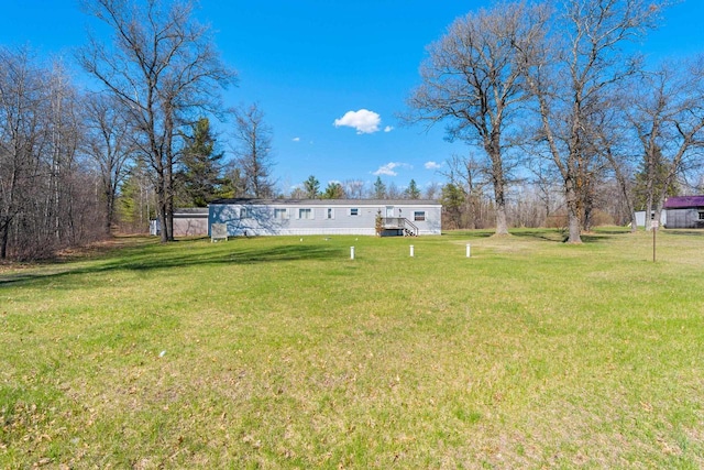 W7730 County Road Z, Pembine, WI 54156 - view of grassy yard with a deck