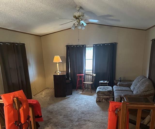 W7730 County Road Z, Pembine, WI 54156 - carpeted living area featuring crown molding, a textured ceiling, lofted ceiling, and a ceiling fan