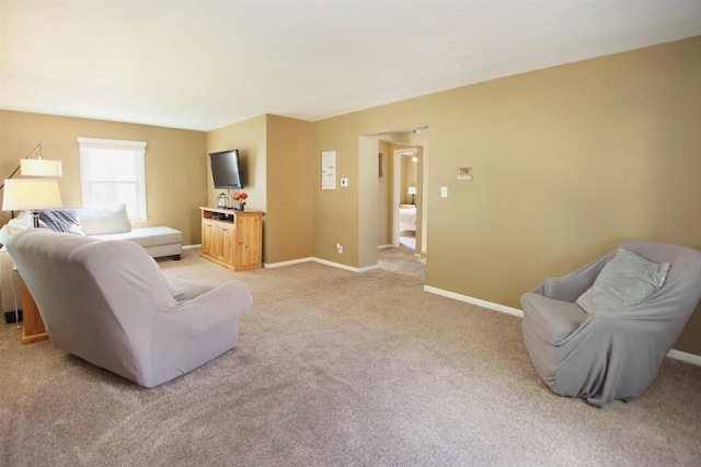 364 E 9th St, Fond Du Lac, WI 54935 - living area featuring light carpet and baseboards