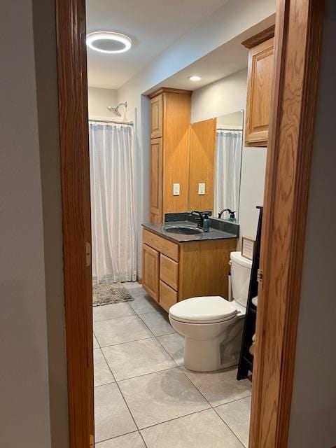 1075 Grant St, Fennimore, WI 53809 - full bath with toilet, tile patterned flooring, vanity, and curtained shower