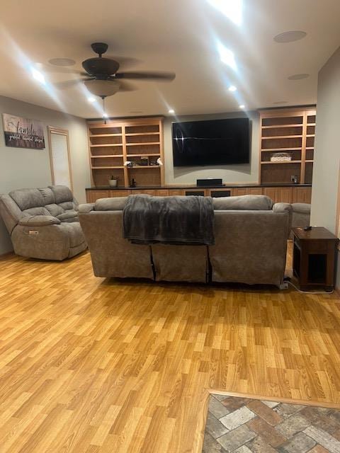 1075 Grant St, Fennimore, WI 53809 - living room featuring built in features, a ceiling fan, and wood finished floors