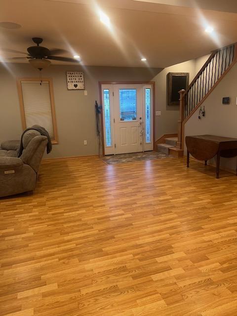 1075 Grant St, Fennimore, WI 53809 - entryway featuring stairway, light wood-type flooring, ceiling fan, and baseboards