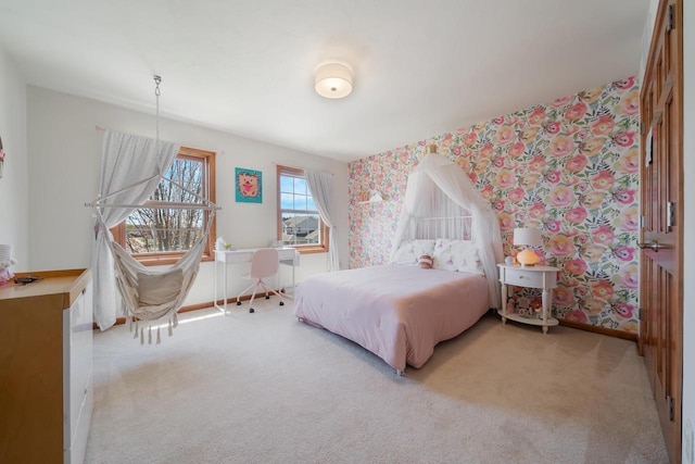 bedroom featuring carpet flooring, baseboards, and wallpapered walls
