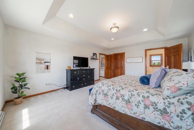 bedroom featuring recessed lighting, baseboards, a raised ceiling, and carpet floors