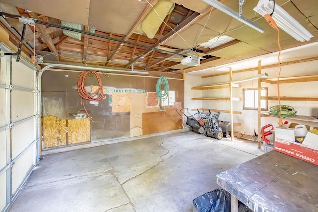 103 E Rollin St, Edgerton, WI 53534 - garage featuring a garage door opener