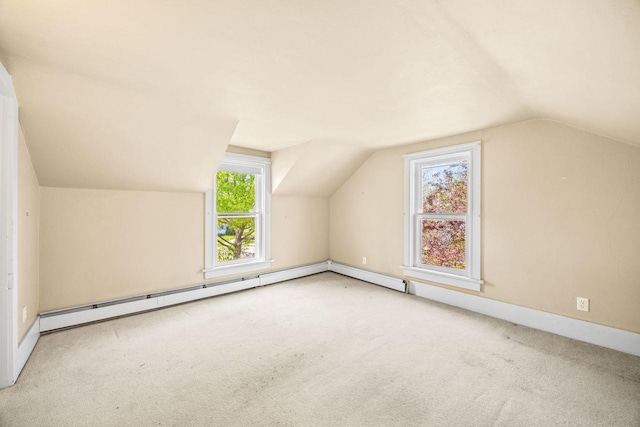 103 E Rollin St, Edgerton, WI 53534 - additional living space featuring vaulted ceiling, carpet flooring, and baseboards