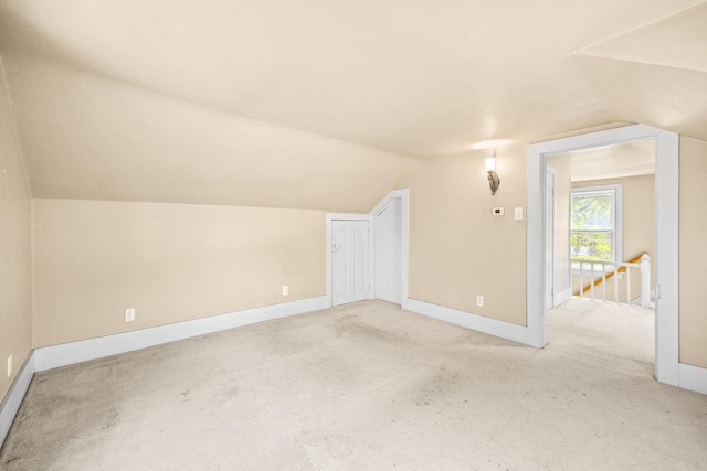 103 E Rollin St, Edgerton, WI 53534 - additional living space with vaulted ceiling, carpet, and baseboards