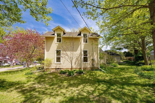 103 E Rollin St, Edgerton, WI 53534 - view of home's exterior featuring a lawn