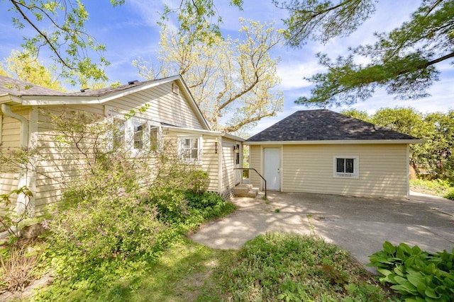 103 E Rollin St, Edgerton, WI 53534 - rear view of property with a shingled roof