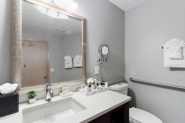 123 Center St Unit 301, Lake Geneva, WI 53147 - bathroom with toilet, vanity, and visible vents